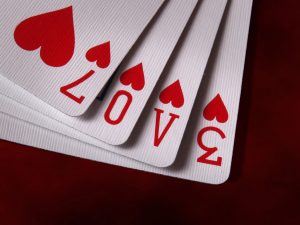 Community members play cards for a cause